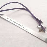 Stamped metal bookmark